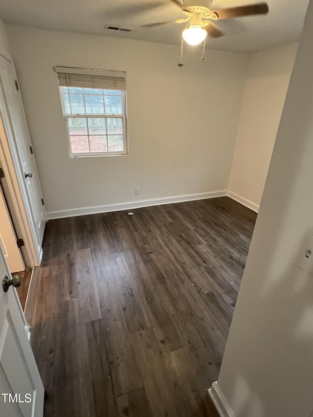 unfurnished bedroom with dark hardwood / wood-style floors and ceiling fan