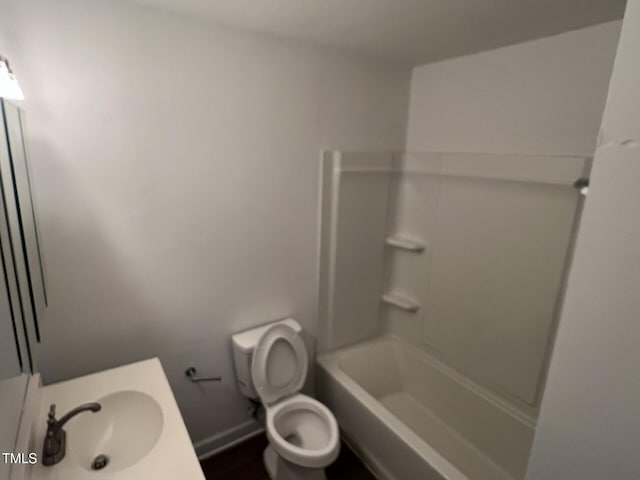 full bathroom with vanity, washtub / shower combination, and toilet