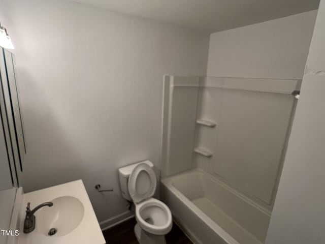 full bathroom with tub / shower combination, toilet, and sink