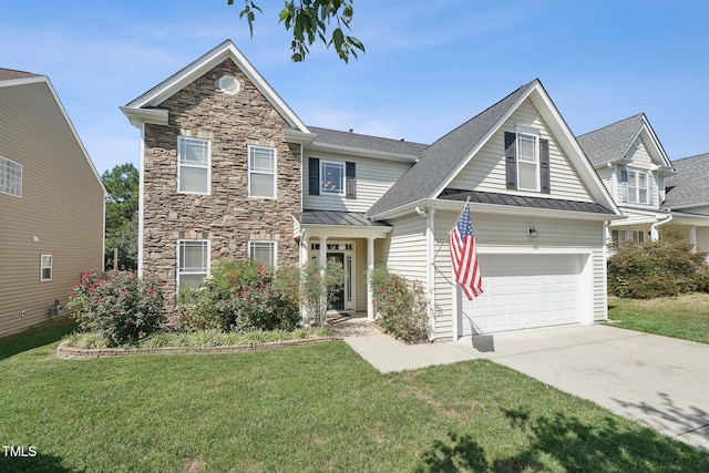 view of front of property featuring a front yard and a garage