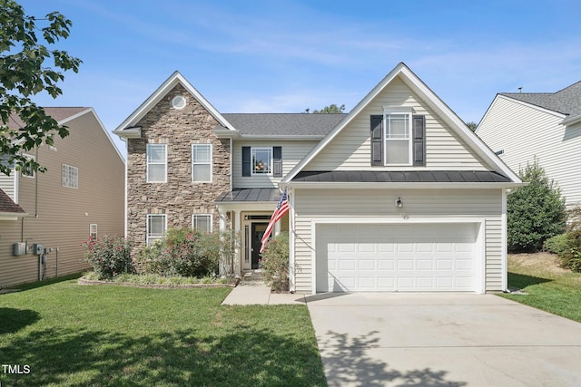 view of front of house with a garage and a front yard