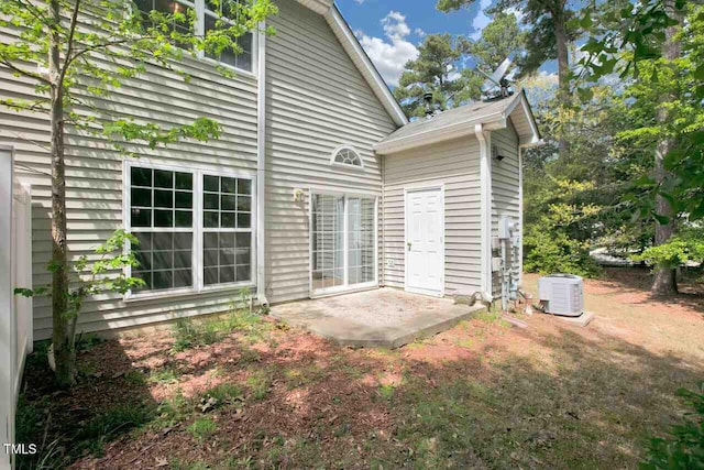 rear view of property featuring a patio area