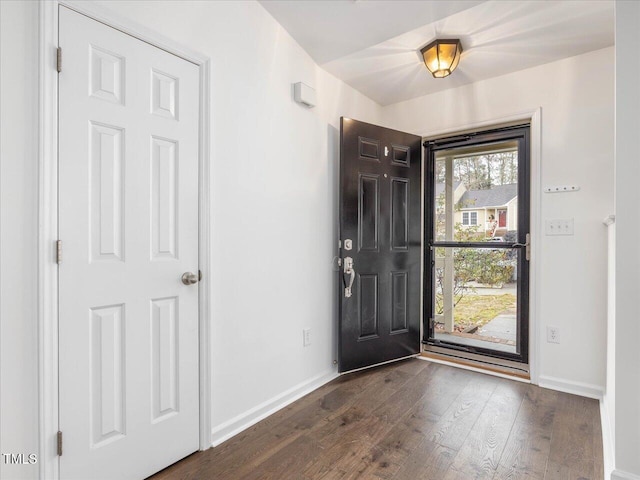 foyer entrance with dark wood-type flooring