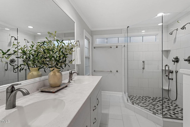 bathroom featuring ornamental molding, tile patterned flooring, vanity, and a shower with shower door