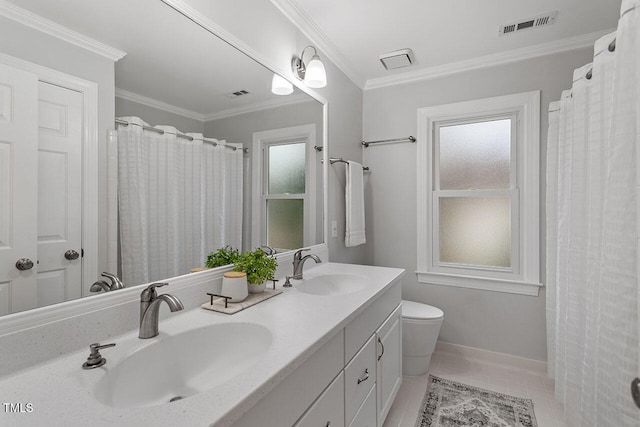 bathroom featuring toilet, ornamental molding, tile patterned floors, and vanity