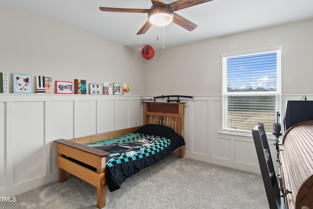 bedroom with ceiling fan and light carpet