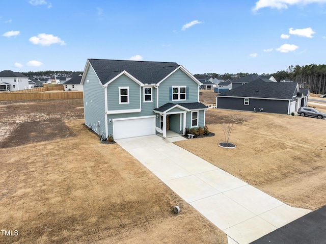 view of front property featuring a front lawn and a garage