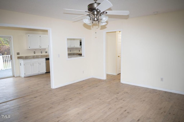 unfurnished dining area with light wood-type flooring and ceiling fan