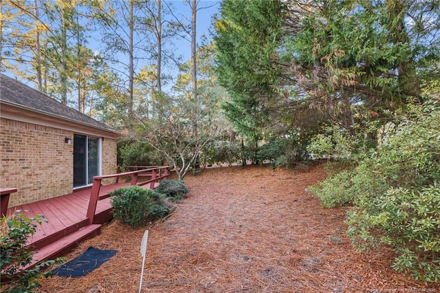 view of yard featuring a deck