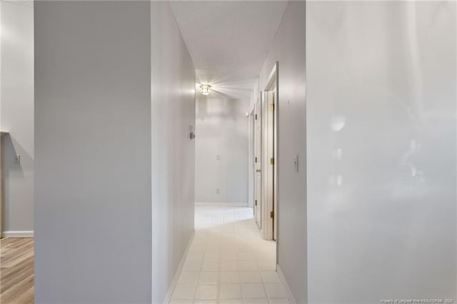 corridor with a textured ceiling