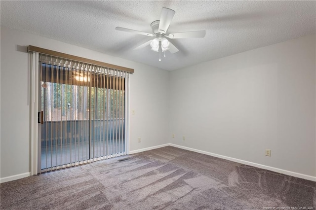 unfurnished room with ceiling fan, carpet floors, and a textured ceiling