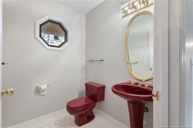 bathroom featuring tile patterned flooring and toilet