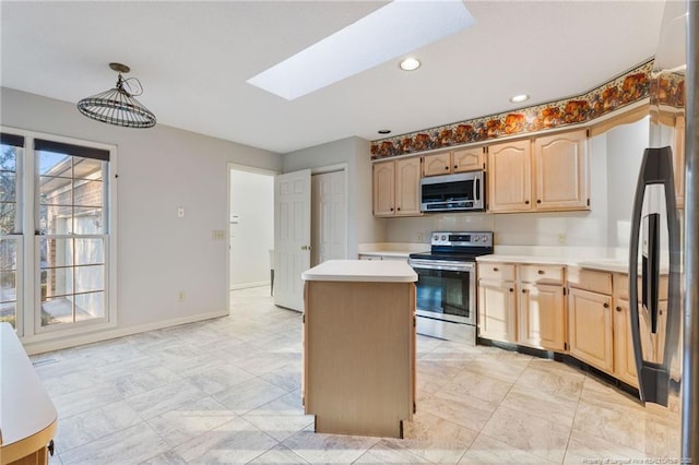 kitchen featuring hanging light fixtures, a skylight, light brown cabinetry, a kitchen island, and stainless steel appliances