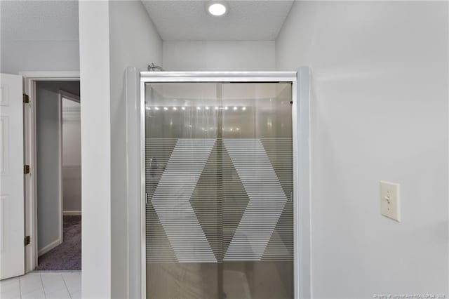 interior details with carpet flooring and a textured ceiling