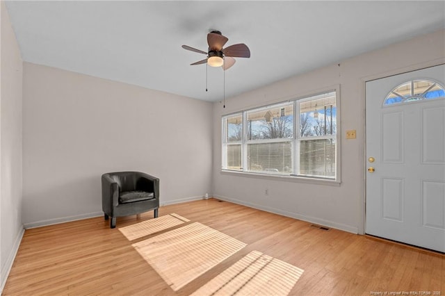 foyer featuring ceiling fan and light hardwood / wood-style floors