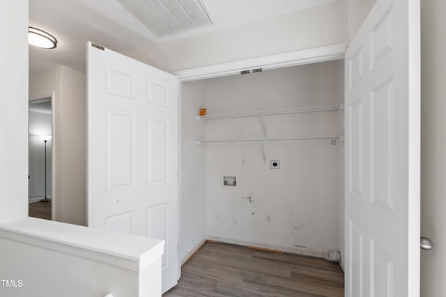 washroom with hookup for a washing machine, hookup for an electric dryer, and wood finished floors