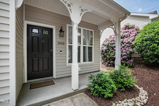doorway to property featuring a porch