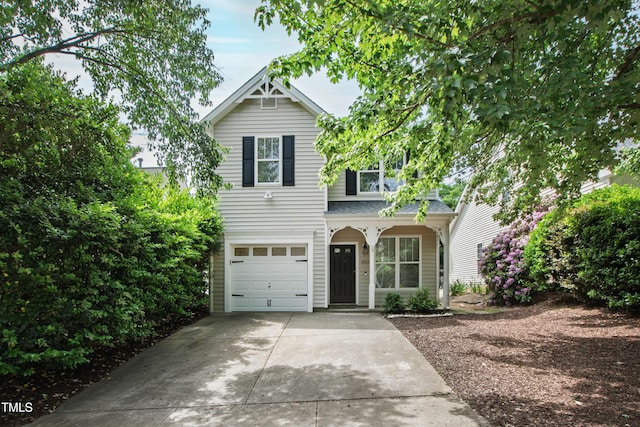 view of front of house featuring an attached garage and concrete driveway