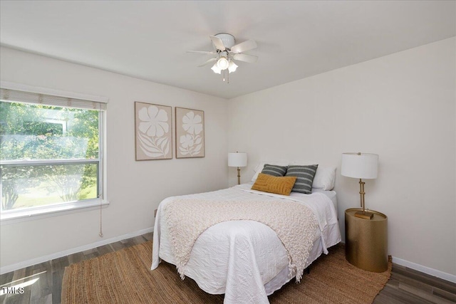 bedroom featuring ceiling fan and dark wood-type flooring