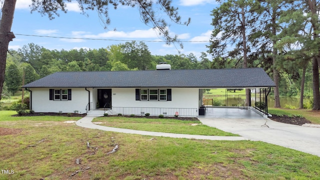 ranch-style home with a front lawn and a carport