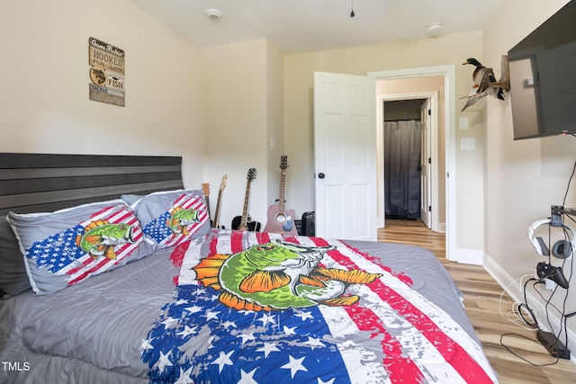 bedroom featuring hardwood / wood-style flooring