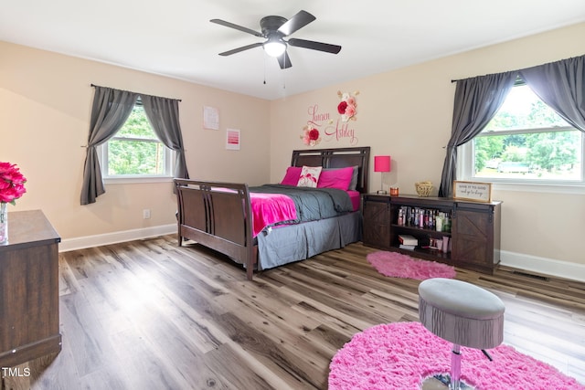 bedroom featuring ceiling fan and wood-type flooring