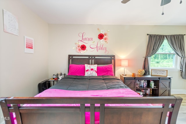 bedroom featuring ceiling fan and hardwood / wood-style floors