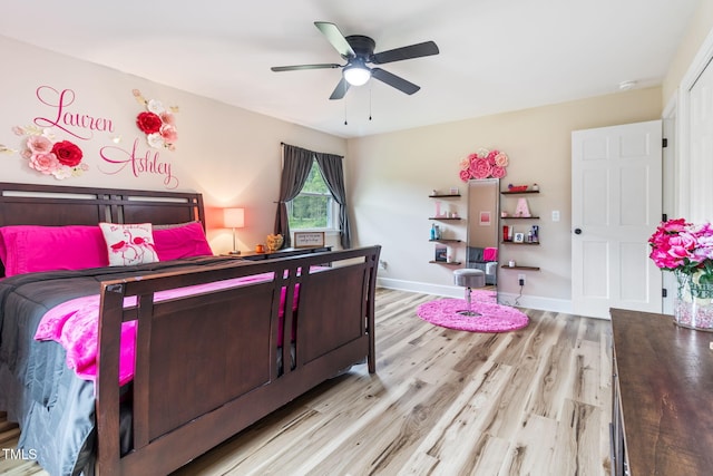 bedroom with ceiling fan and light hardwood / wood-style flooring