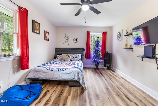 bedroom featuring light wood-type flooring and ceiling fan