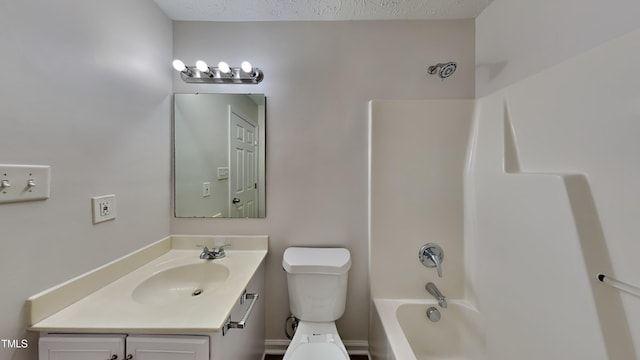 full bathroom featuring toilet, vanity, a textured ceiling, and washtub / shower combination