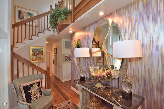 hallway with hardwood / wood-style flooring