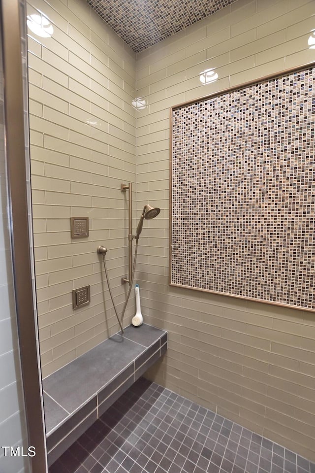 bathroom with tiled shower