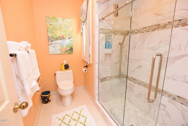 bathroom with toilet, tile patterned floors, and walk in shower