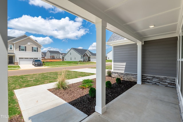 view of patio featuring a residential view and covered porch