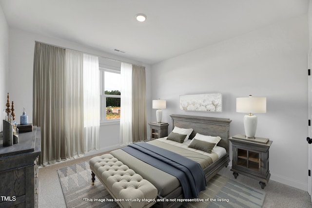 bedroom featuring carpet flooring and baseboards