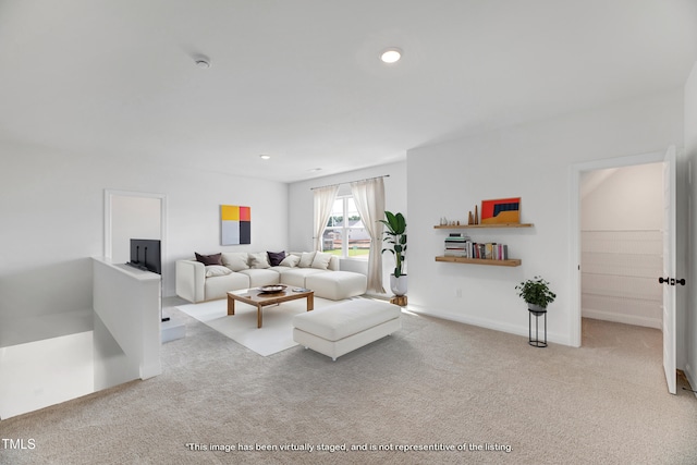 carpeted living room featuring recessed lighting and baseboards