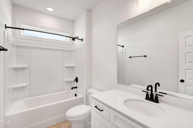 bathroom with toilet, vanity, tub / shower combination, and tile patterned flooring