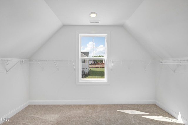 bonus room with lofted ceiling, carpet floors, and baseboards