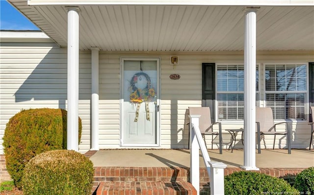 property entrance featuring covered porch