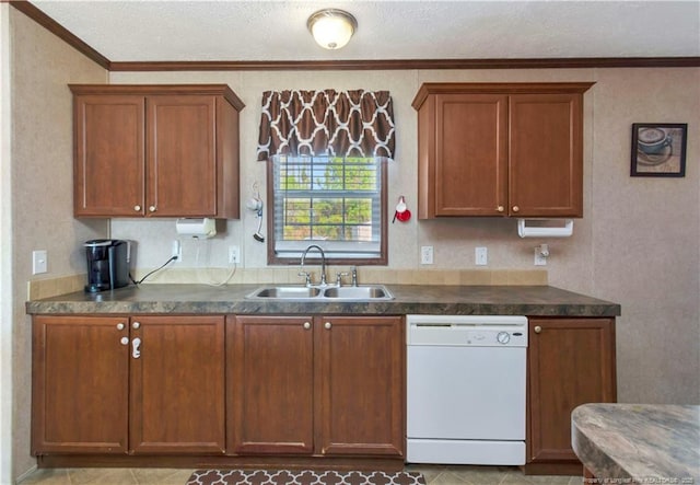 kitchen featuring white dishwasher, a sink, ornamental molding, brown cabinets, and dark countertops