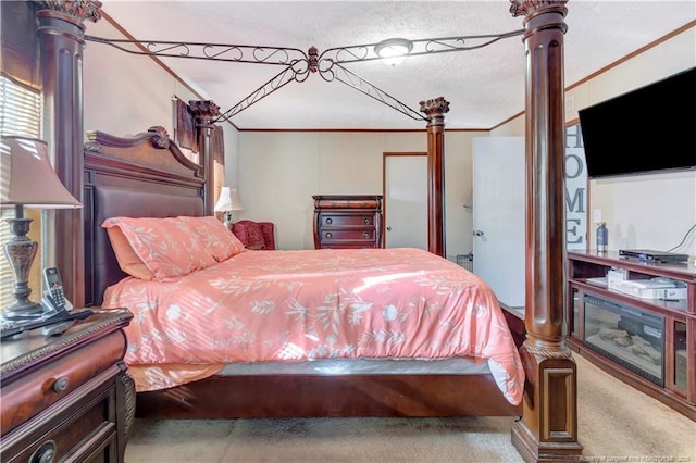 carpeted bedroom featuring ornamental molding and decorative columns