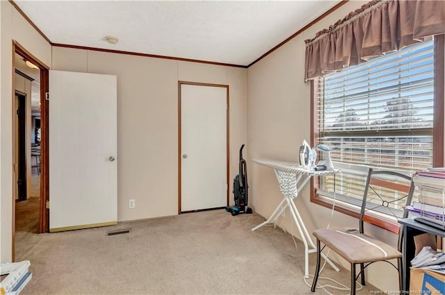 miscellaneous room featuring ornamental molding, visible vents, and light colored carpet