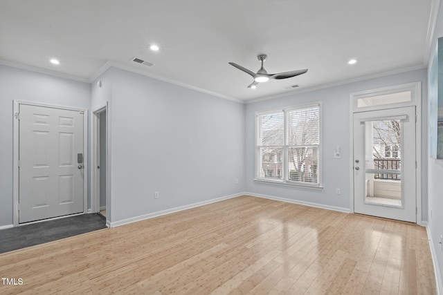 unfurnished living room featuring ceiling fan, crown molding, and wood-type flooring