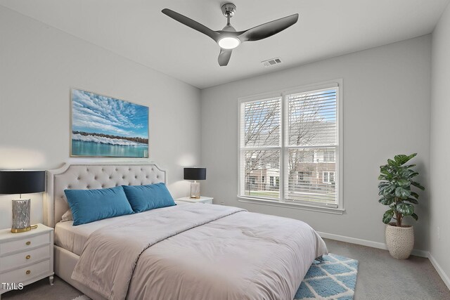 bedroom featuring carpet floors, visible vents, baseboards, and ceiling fan