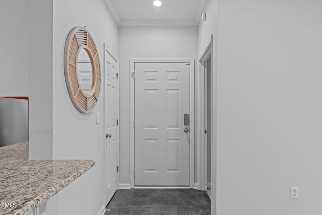 doorway featuring recessed lighting, crown molding, and baseboards