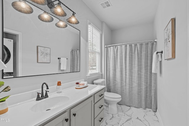 bathroom featuring marble finish floor, plenty of natural light, vanity, and visible vents