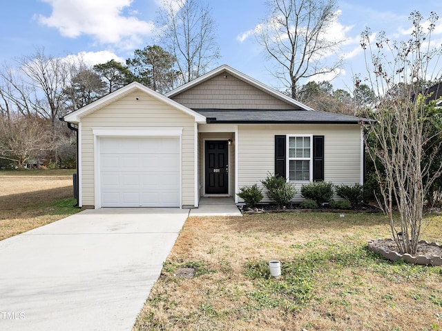 ranch-style house featuring a front lawn and a garage