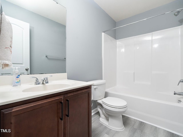 full bathroom with shower / tub combination, vanity, toilet, and hardwood / wood-style floors