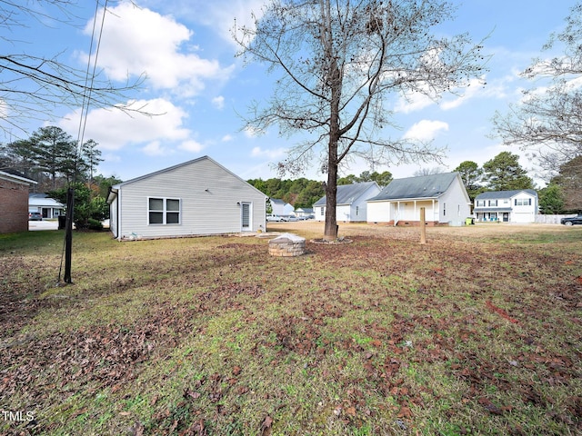 view of property exterior with a yard