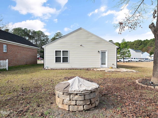 rear view of house with a lawn